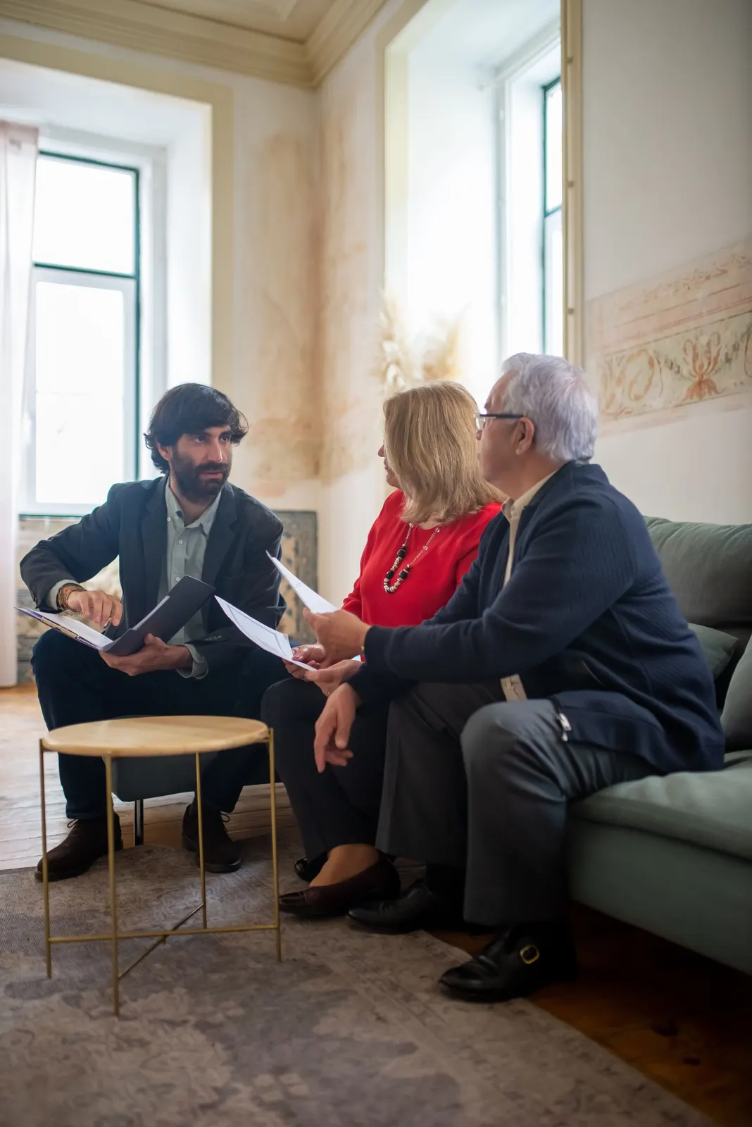 An older couple in conversation in their living room